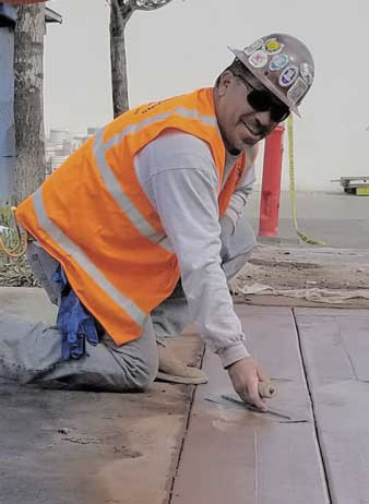 Trainer demonstrating Concrete Finishing